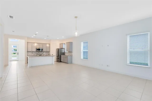 a view of kitchen with furniture and window