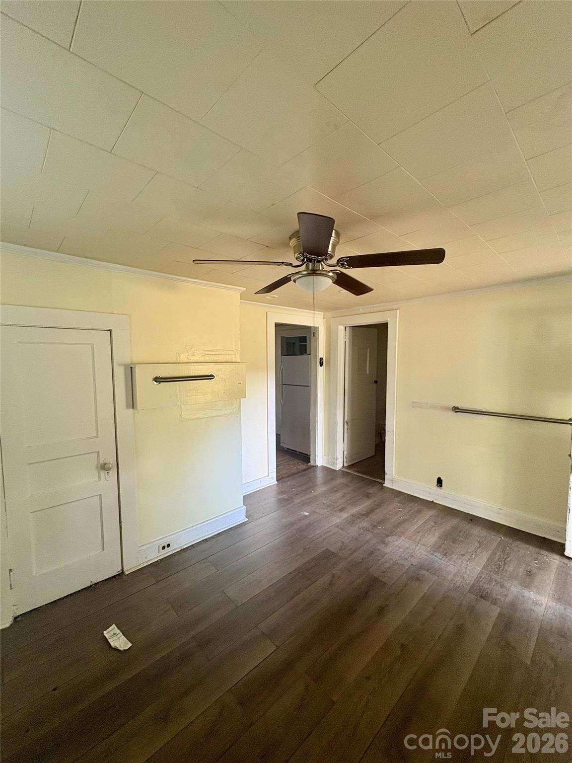 1105 John Miller Road Rockwell, NC 28138 - Photo 5 of 19 an empty room with wooden floor and cabinet