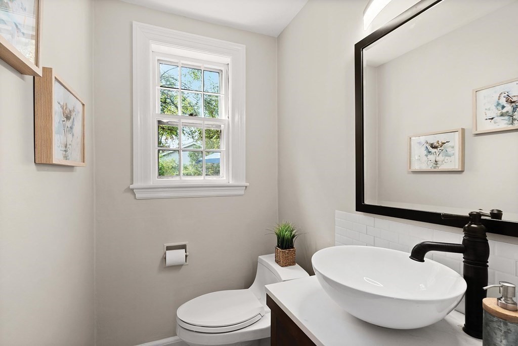 27 Conant Road Brookline, MA 02467 - Photo 11 of 23 a bathroom with a toilet a sink and a mirror