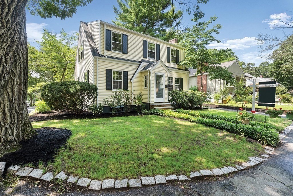 27 Conant Road Brookline, MA 02467 - Photo 3 of 23 a front view of a house with a yard