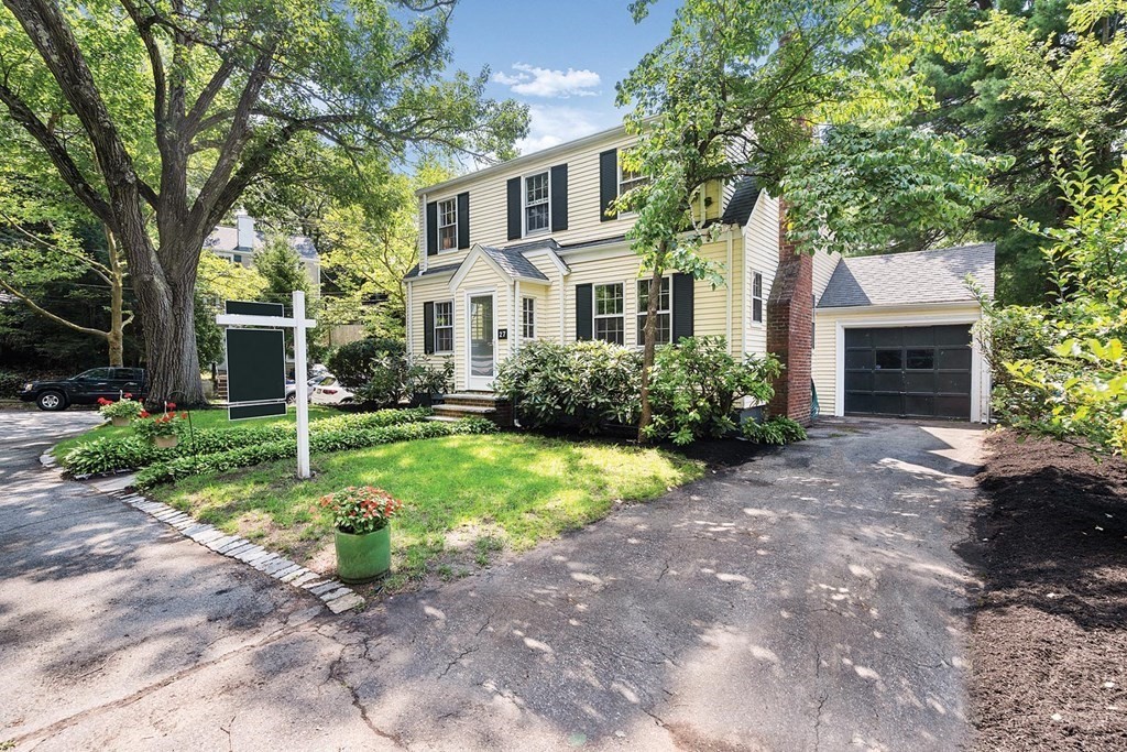 27 Conant Road Brookline, MA 02467 - Photo 4 of 23 a front view of a house with garden