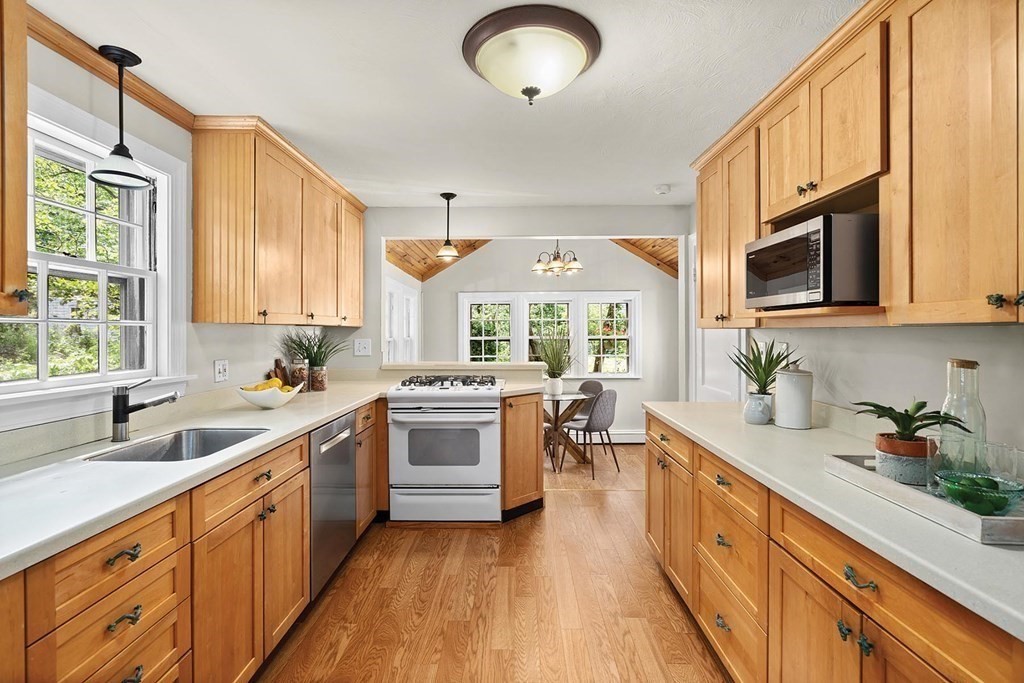 27 Conant Road Brookline, MA 02467 - Photo 7 of 23 a kitchen with a sink appliances cabinets and a window