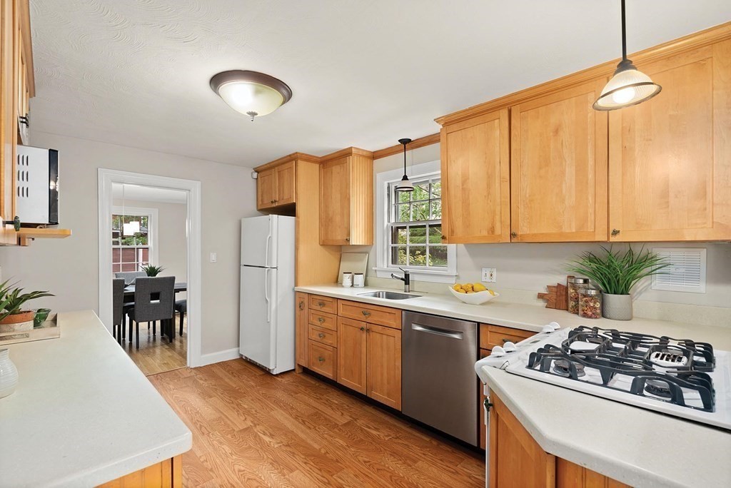 27 Conant Road Brookline, MA 02467 - Photo 8 of 23 a kitchen with a sink stove and cabinets