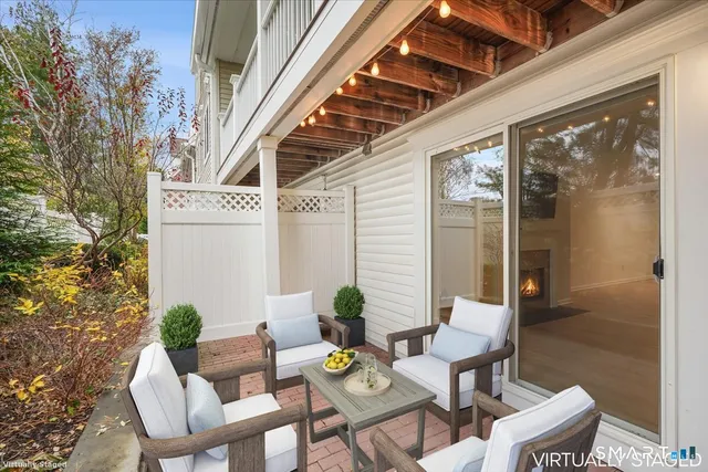 a view of a chairs and table in a patio
