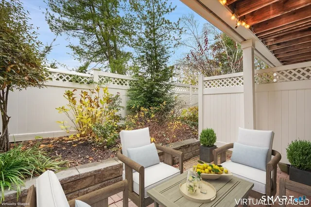 a view of a chairs and table in a patio
