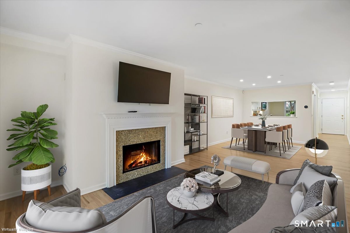 51 Forest Avenue Greenwich, CT 06870 - Photo 2 of 27 a living room with furniture and a fireplace