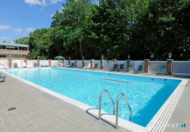 a view of swimming pool with a patio