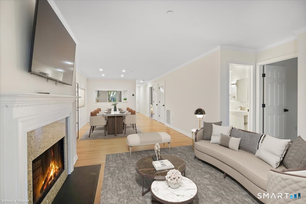 51 Forest Avenue Greenwich, CT 06870 - Photo 3 of 27 a living room with furniture and a fireplace