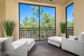 a view of a two chairs in the balcony