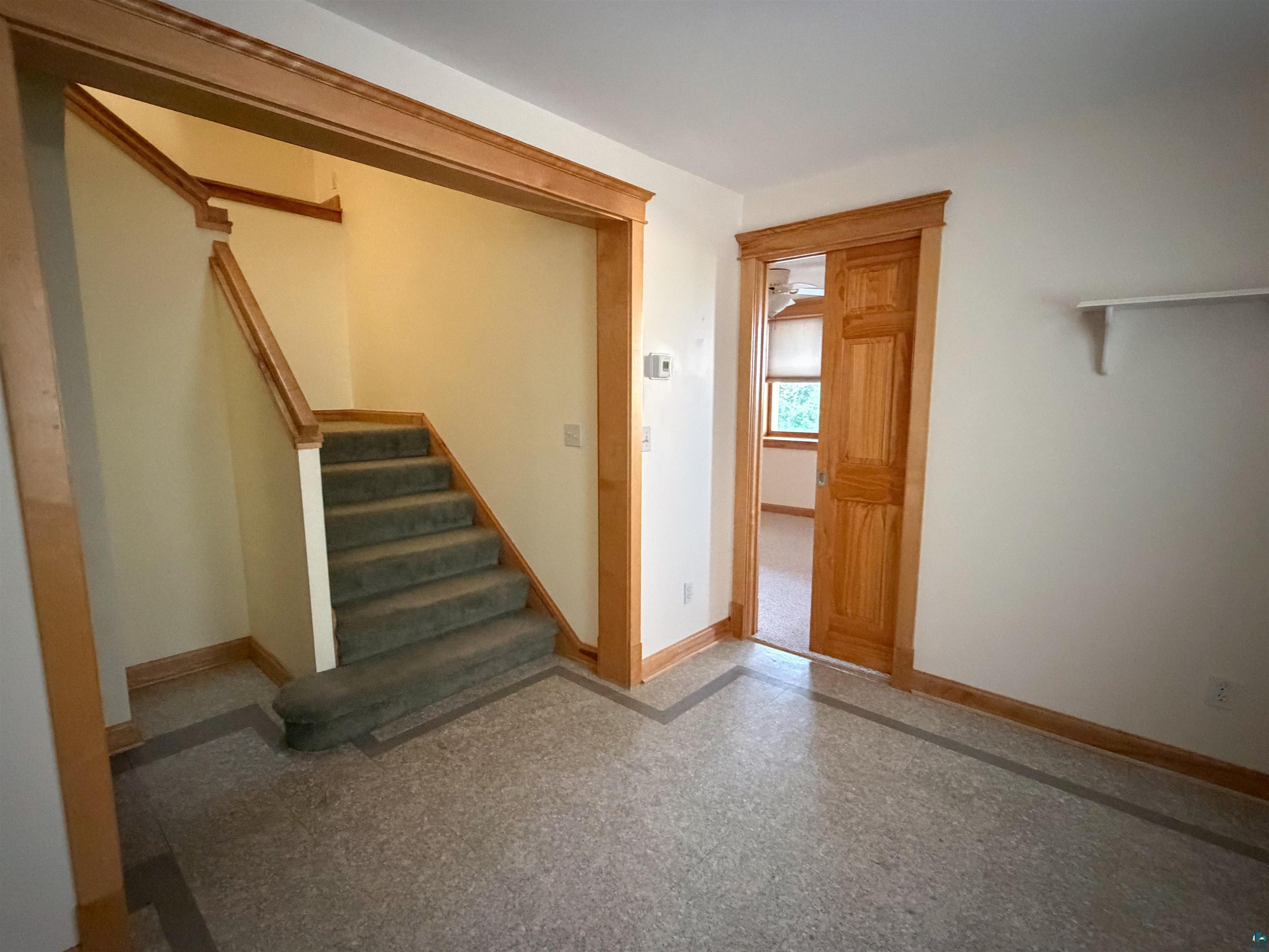 13 West 8th Street Duluth, MN 55806 - Photo 37 of 57 Entryway featuring light-toned walls and wood trim accents