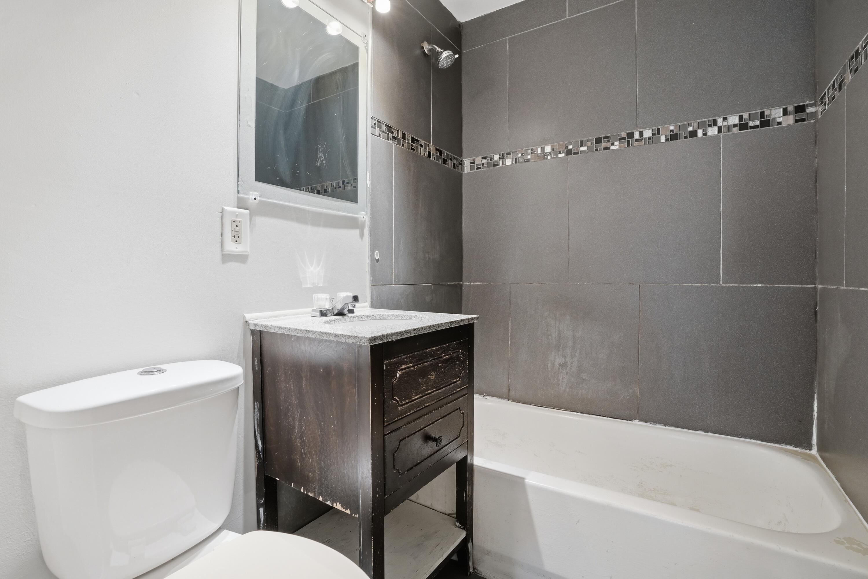 1075 Mount Street Gary, IN 46406 - Photo 11 of 11 a bathroom with a sink toilet and shower
