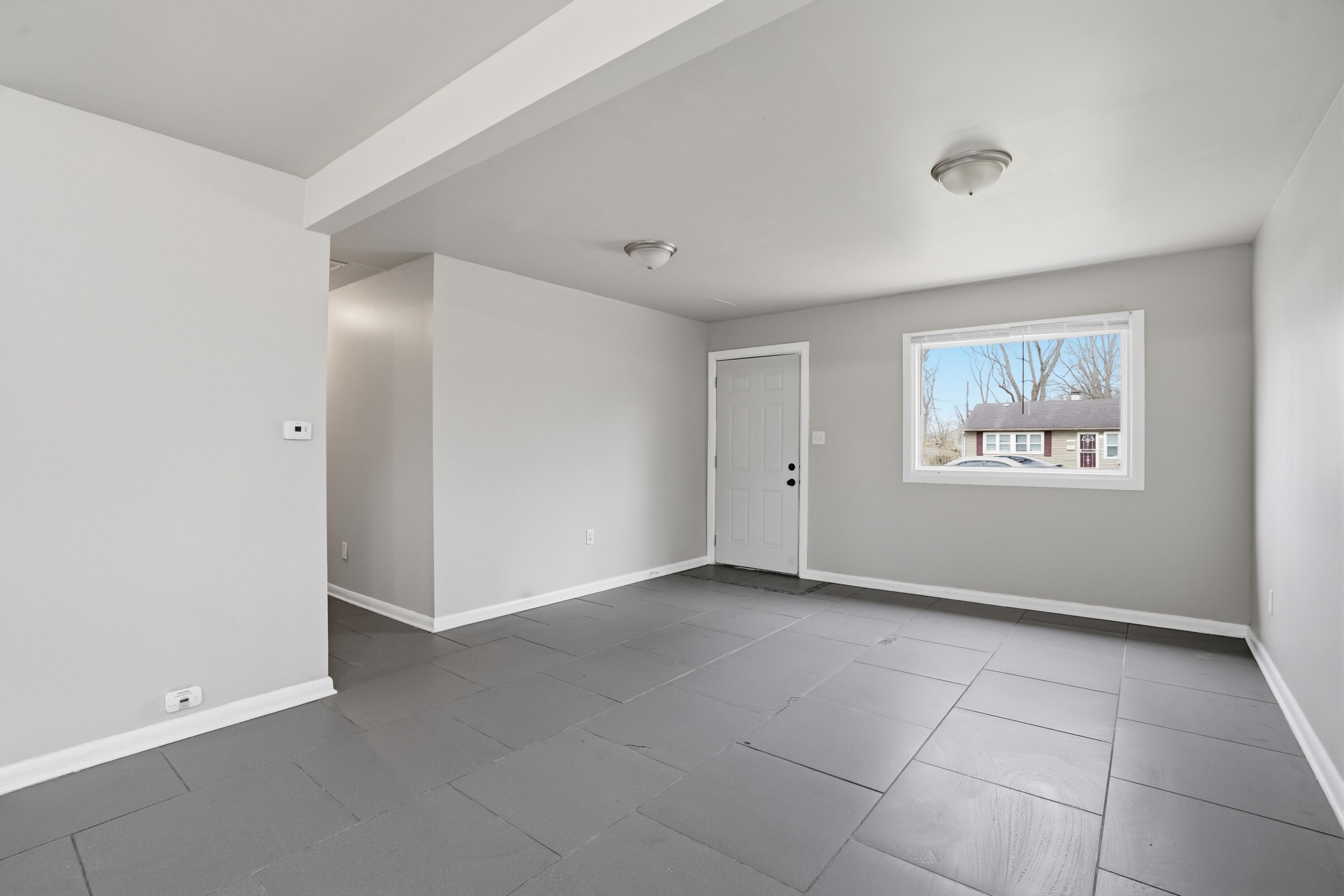 1075 Mount Street Gary, IN 46406 - Photo 4 of 11 a view of an empty room with a window