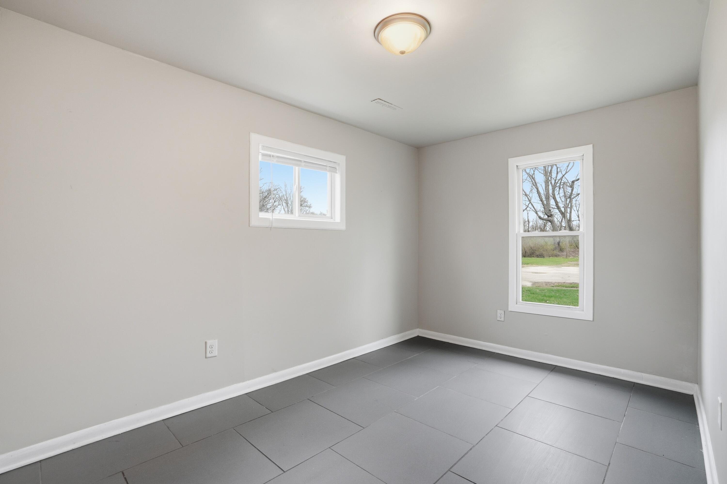 1075 Mount Street Gary, IN 46406 - Photo 5 of 11 an empty room with a window