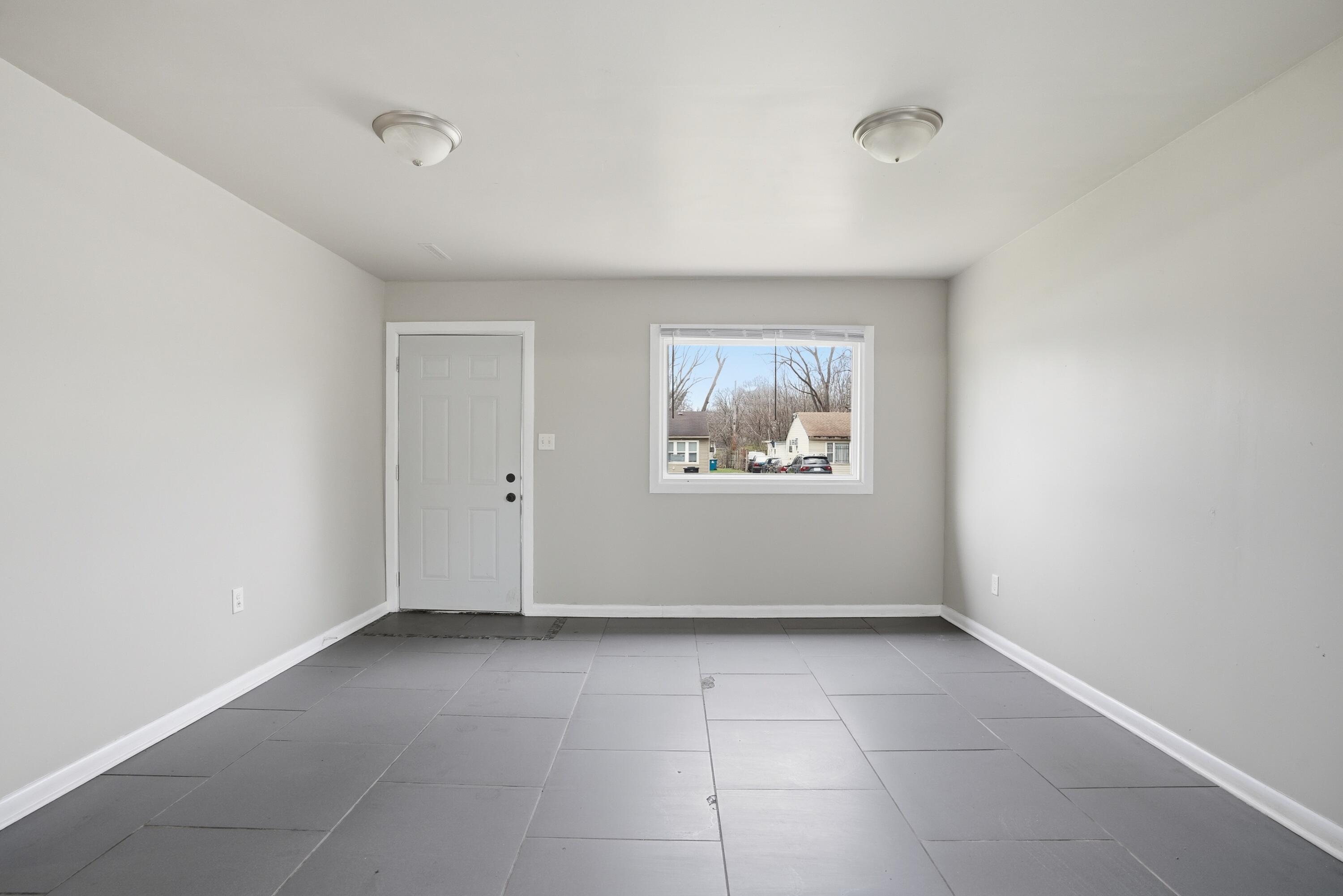 1075 Mount Street Gary, IN 46406 - Photo 6 of 11 an empty room with windows