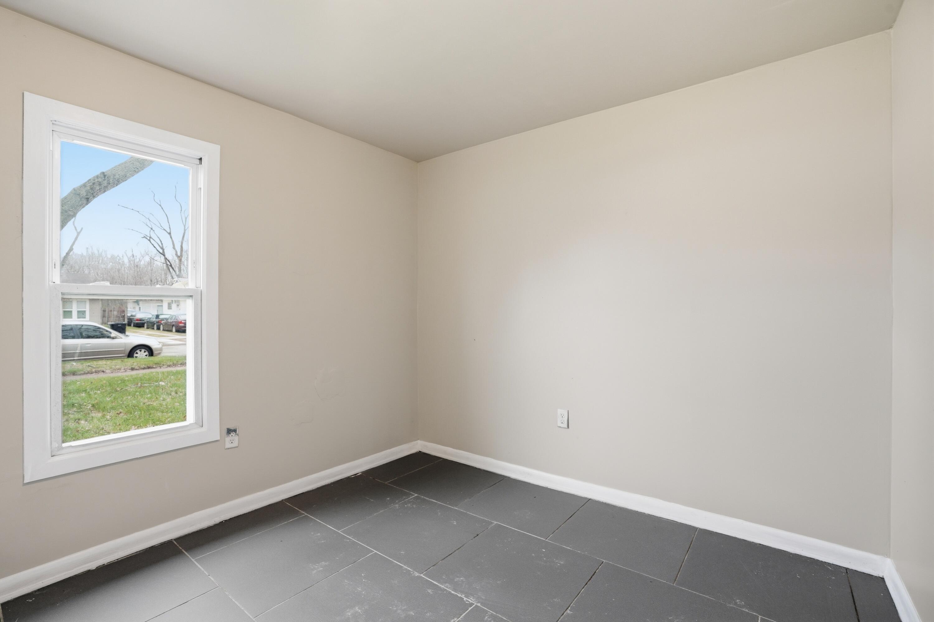 1075 Mount Street Gary, IN 46406 - Photo 7 of 11 a room that has a window