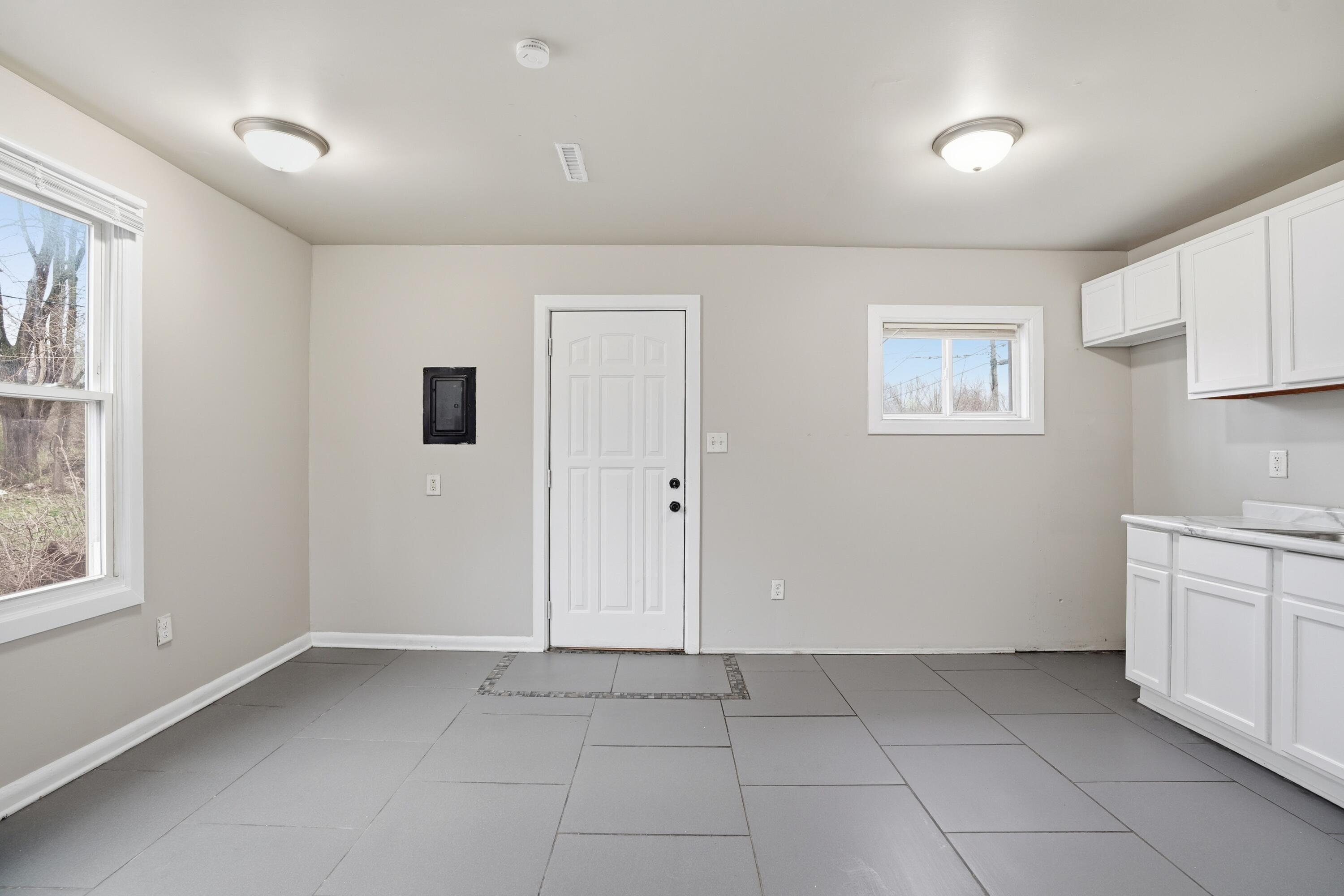 1075 Mount Street Gary, IN 46406 - Photo 8 of 11 a view of a kitchen with dishwasher and a refrigerator