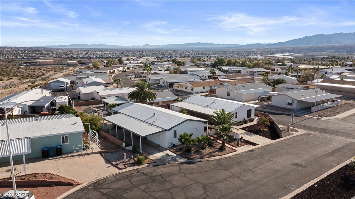 1655 Granada Street Laughlin, NV 89029 - Photo 63 of 76 Aerial view of residential area with a mountain backdrop