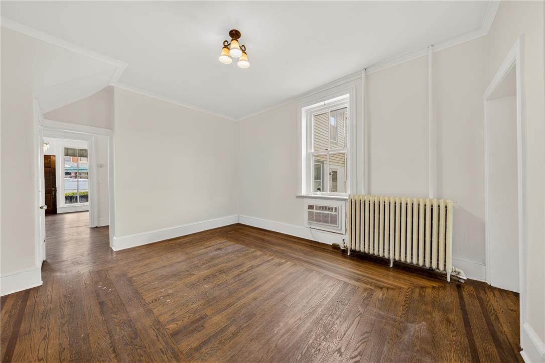 65 2nd Street Slatington, PA 18080 - Photo 15 of 46 This naturally illuminated living area showcases rich hardwood flooring and classic radiator heating.