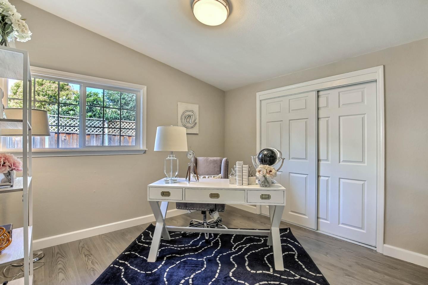 18911 Arata Way Cupertino, CA 95014 - Photo 13 of 18 a view of a dining room with furniture window and wooden floor