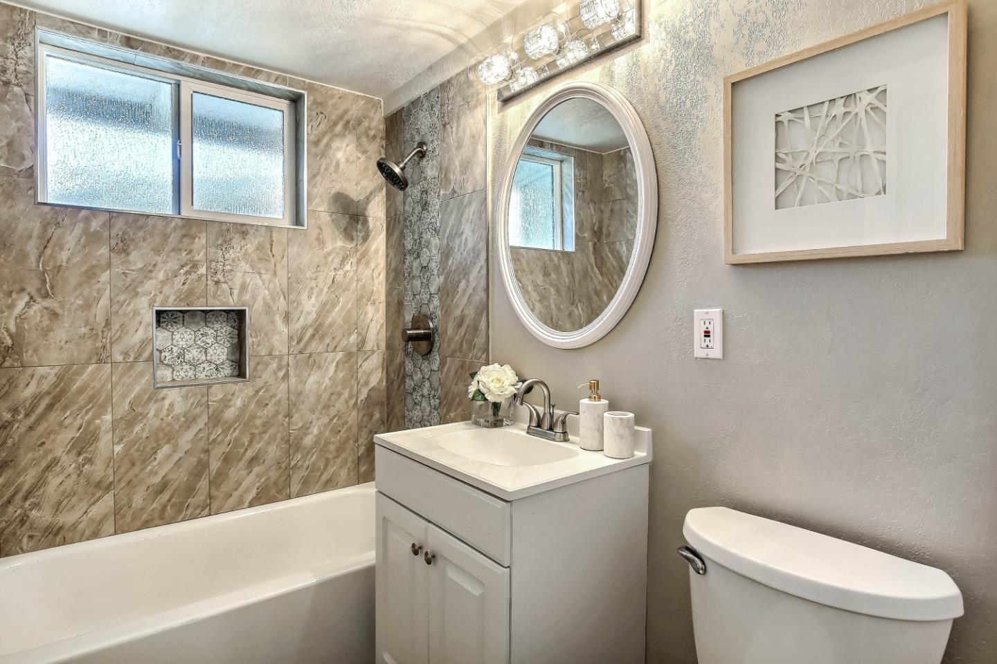 18911 Arata Way Cupertino, CA 95014 - Photo 14 of 18 a bathroom with a toilet a sink and a bathtub