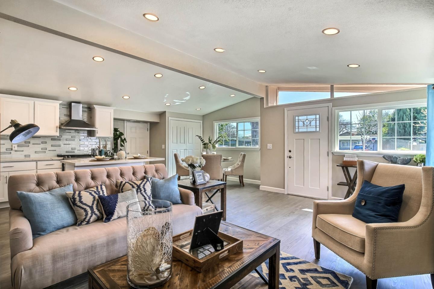 18911 Arata Way Cupertino, CA 95014 - Photo 4 of 18 a living room with furniture wooden floor and kitchen view