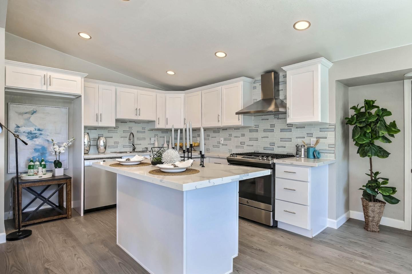 18911 Arata Way Cupertino, CA 95014 - Photo 5 of 18 a kitchen with a sink stove and cabinets