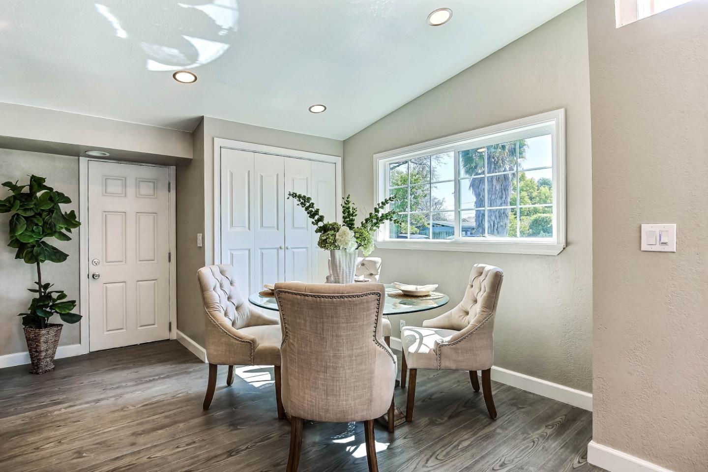 18911 Arata Way Cupertino, CA 95014 - Photo 7 of 18 a view of a dining room with furniture window and wooden floor