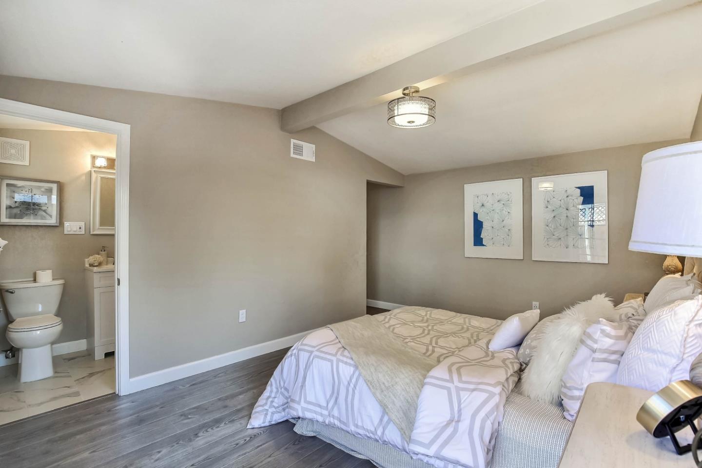 18911 Arata Way Cupertino, CA 95014 - Photo 10 of 18 a bedroom with a bed and a lamp