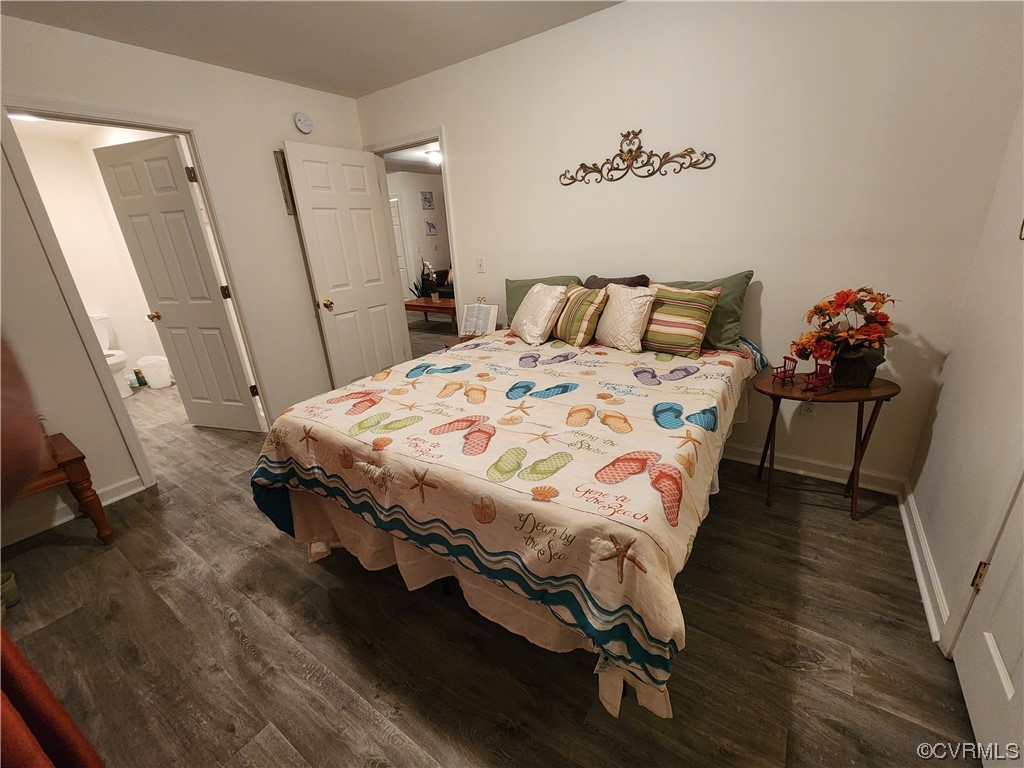 142 Samford Street Alberta, VA 23821 - Photo 11 of 24 a bedroom with a bed and wooden floor