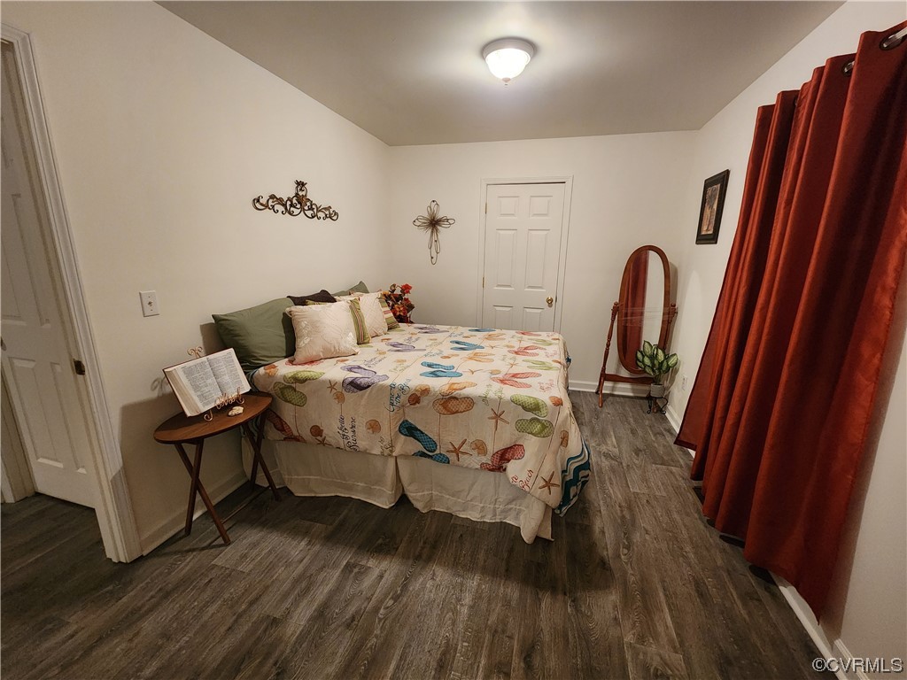 142 Samford Street Alberta, VA 23821 - Photo 9 of 24 a bedroom with a bed and wooden floor
