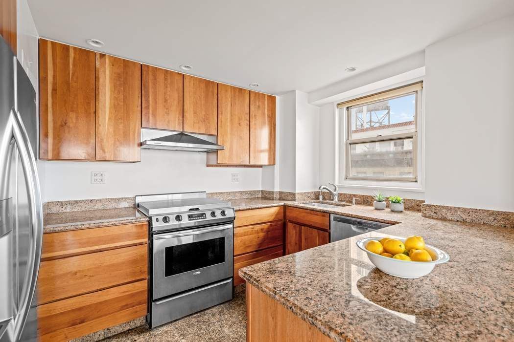60 Riverside Drive, Unit 19C Manhattan, NY 10024 - Photo 14 of 16 a kitchen with a stove a sink and a window