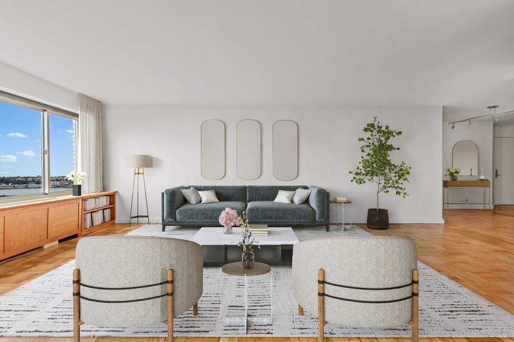 60 Riverside Drive, Unit 19C Manhattan, NY 10024 - Photo 4 of 16 a living room with furniture and a fireplace