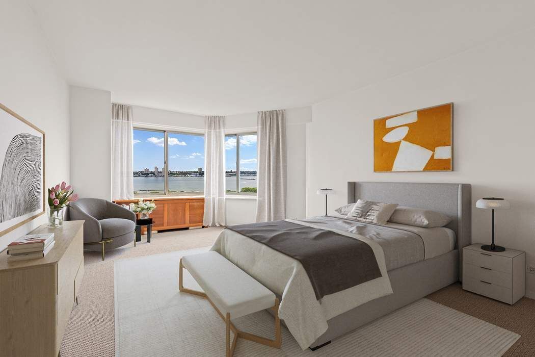 60 Riverside Drive, Unit 19C Manhattan, NY 10024 - Photo 6 of 16 a bedroom with a bed and couch