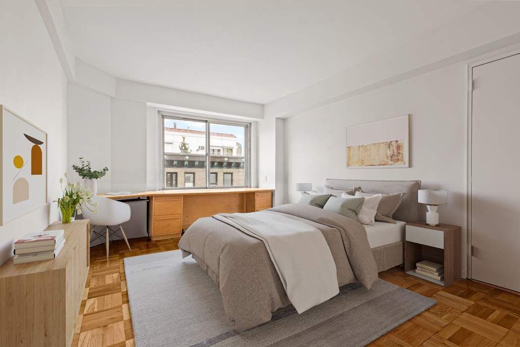 60 Riverside Drive, Unit 19C Manhattan, NY 10024 - Photo 7 of 16 a bedroom with a large bed and a window