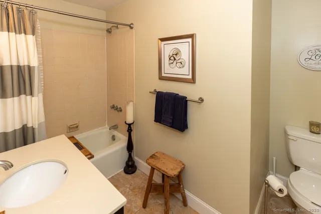 a bathroom with a sink vanity and a mirror