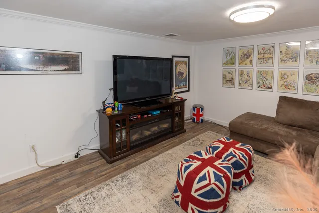a room with wooden floor and table tennis