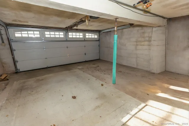 a view of a roof deck with wooden floor and fence and a couch