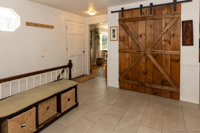 a kitchen with cabinets appliances a sink and a window