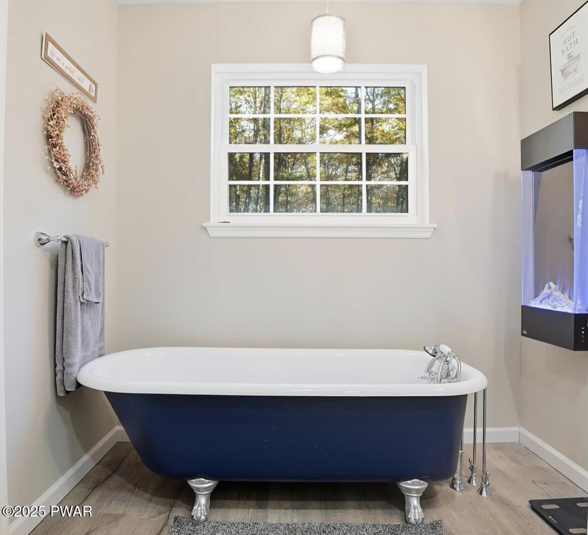 116 Quail Court Bushkill, PA 18324 - Photo 24 of 44 Primary bathroom tub & fireplace