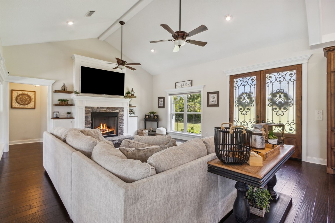 37221 Poole Road Hilliard, FL 32046 - Photo 3 of 67 a living room with furniture a fireplace and a flat screen tv