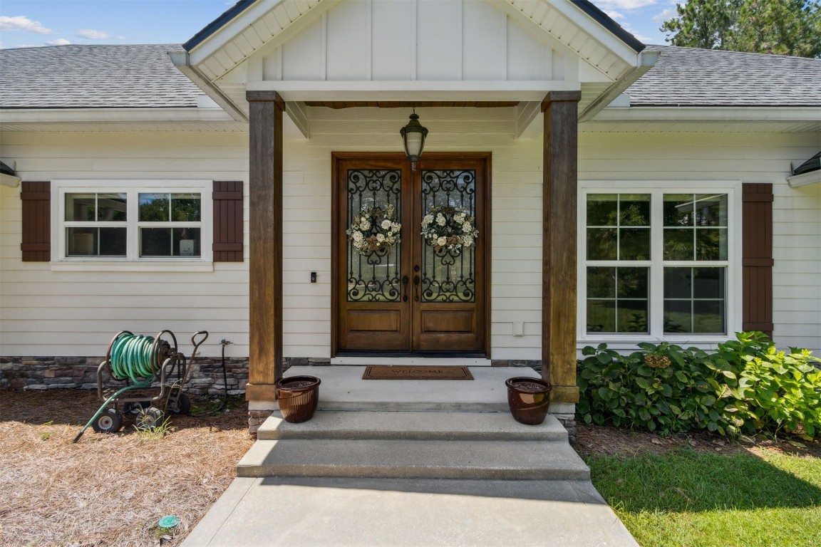 37221 Poole Road Hilliard, FL 32046 - Photo 50 of 67 a front view of a house with a porch