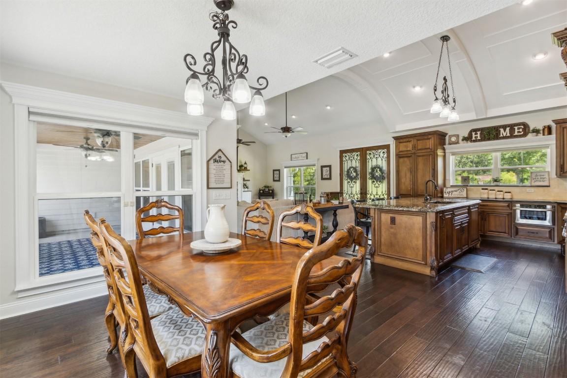37221 Poole Road Hilliard, FL 32046 - Photo 52 of 67 a view of a dining room with furniture window and wooden floor