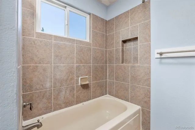 a bathroom with a bathtub