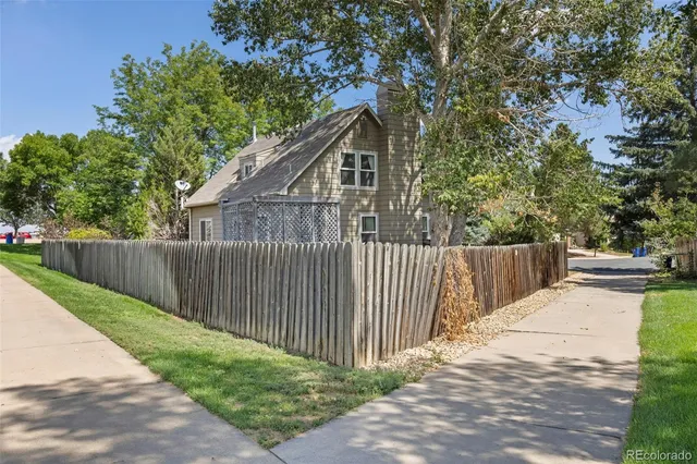 a view of balcony with wooden fence