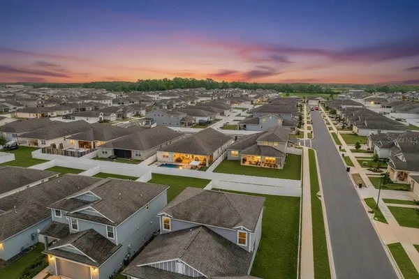 a view of a patio with a table and chairs and floor to ceiling window