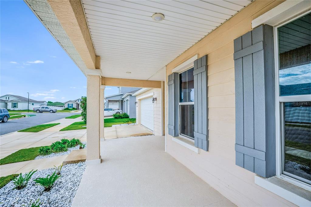 6200 Southwest 72nd Terrace Ocala, FL 34474 - Photo 15 of 70 a view of a patio with a table and chairs and floor to ceiling window