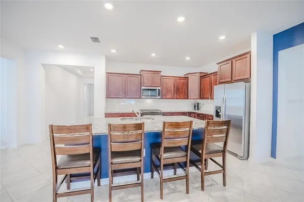 a living room with furniture ceiling fan and a rug