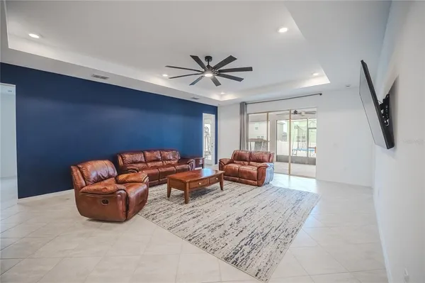 a bathroom with a granite countertop sink a toilet and a mirror