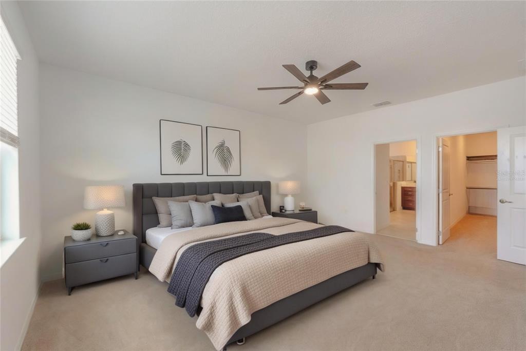 6200 Southwest 72nd Terrace Ocala, FL 34474 - Photo 33 of 70 a bedroom with a bed and a chandelier