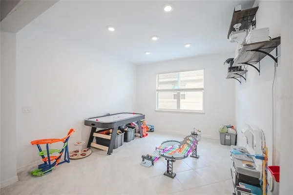 a bathroom with a bathtub shower sink vanity and toilet